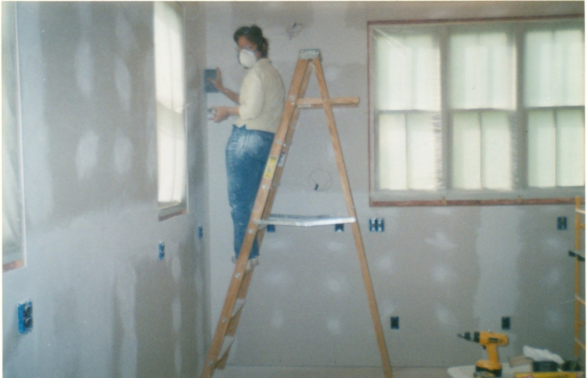 Tapeing, floating, and sanding kitchen walls