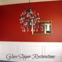 Dining room with red walls and faux wainscoting (picture frame mouldings)